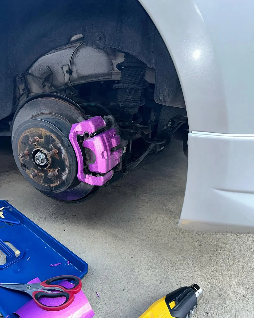 Wheel and caliper detail on a client car in the garage