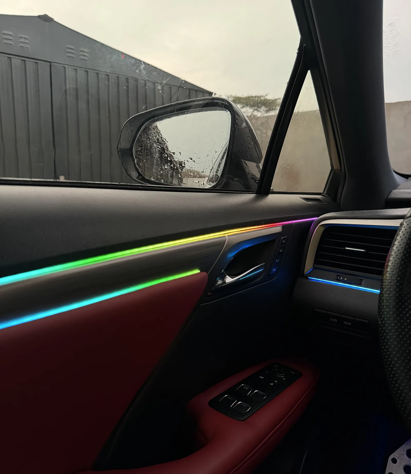 Ambient light line running along a Lexus RX450h door card